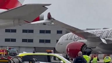 Two planes at Heathrow Airport collide wings on the runway