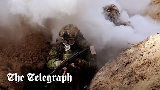 Watch: Ukrainians prepare for Russian chemical attacks