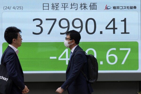 Stock market today: Asian benchmarks mostly slide as investors focus on earnings