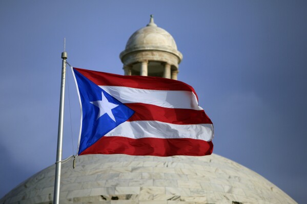 Puerto Rico’s two biggest parties hold primaries as governor seeks 2nd term and voters demand change