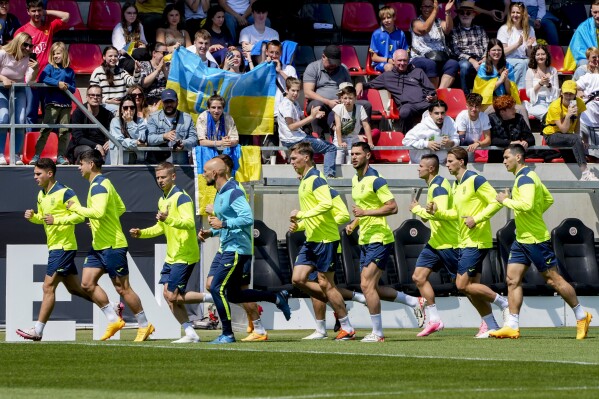 Ukraine arrives at Euro 2024 to a patriotic welcome and vivid reminder of the war at home