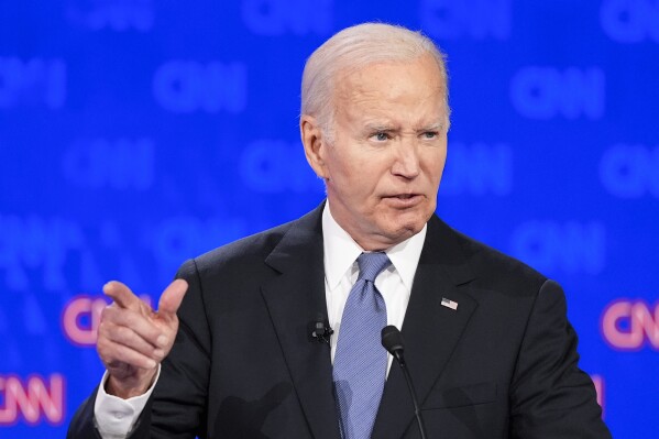 Trump and Biden spar on economy after skipping handshake at start of debate