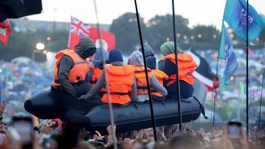 Banksy claims migrant boat artwork in crowd at Glastonbury