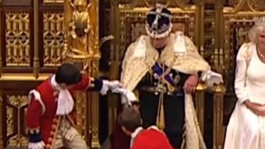 King Charles appears to get frustrated with robe during State Opening of Parliament