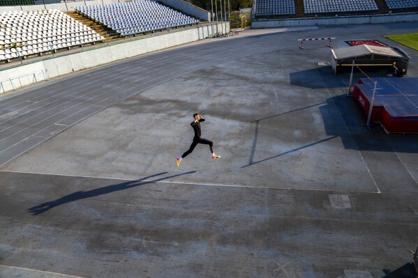 The loneliness of an Olympic athlete training in wartime Ukraine through an AP photographer’s lens