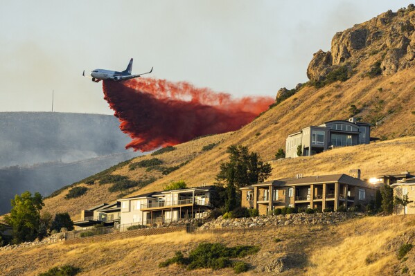 Salt Lake City wildfire prompts mandatory evacuations as more than 100 firefighters fight blaze