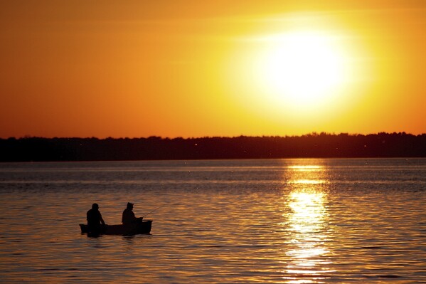 Wisconsin agrees to drop ban on carrying firearms while fishing following challenge