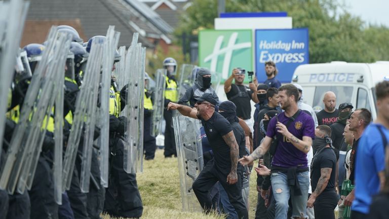 Rioters break into Holiday Inn hotel in Rotherham as injured police officer carried away by colleagues