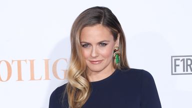 Alicia Silverstone says she is 'alive and well' after appearing to eat poisonous fruit