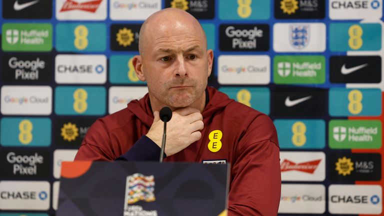 England's new interim manager says he won't be singing national anthem before Republic of Ireland clash