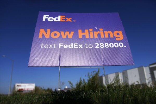 The number of Americans filing for jobless aid falls to lowest level in four months