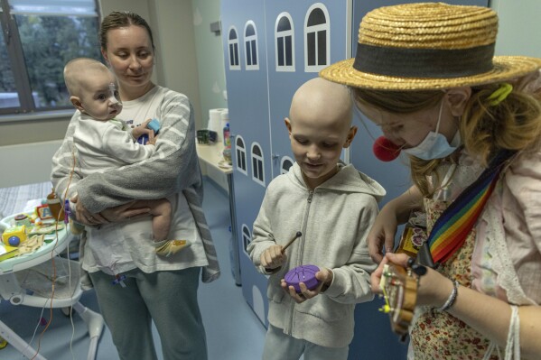 Hospital clowns bring joy to young Ukrainian cancer patients who survived Russian missile attack