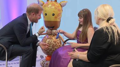 Prince Harry receives gifts from inspirational girl, 10, at WellChild Awards in London